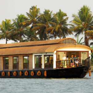 Foreigners enjoying serene backwaters in Best houseboats Alleppey
