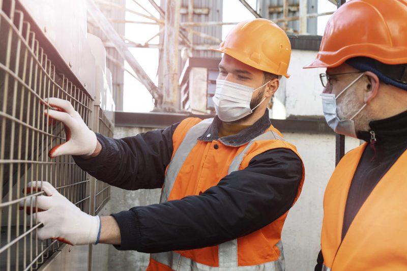 close-up-men-with-masks-working-together